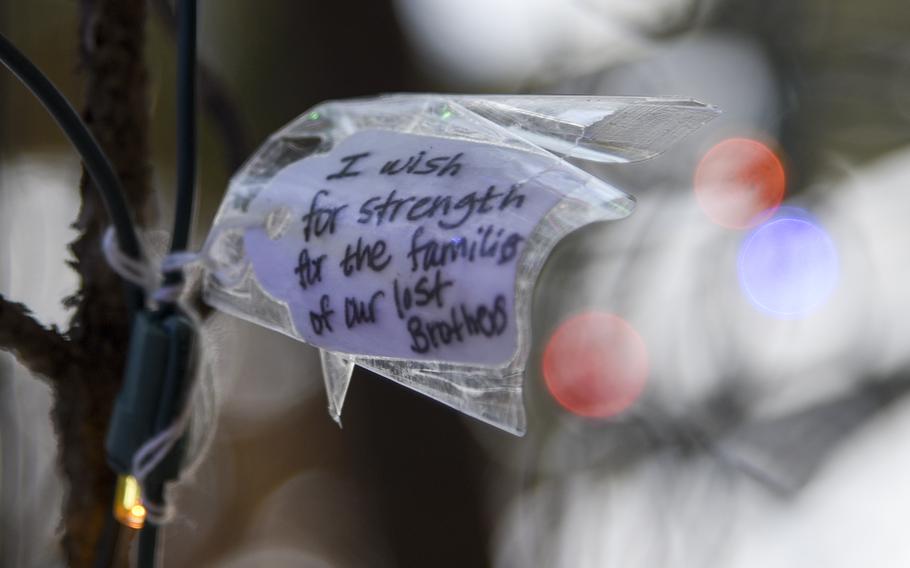 Some notes left on the Larsen family wishing tree at Yokota Air Base, shown here on Dec. 20, reflect the loss of the crew aboard an Air Force CV-22 Osprey in November.
