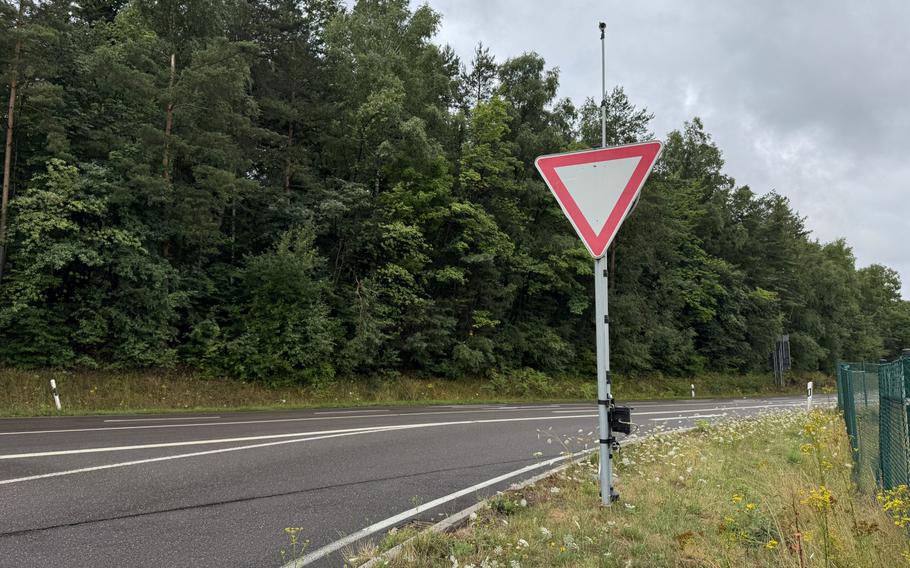 A traffic counter camera is installed on a yield sign.