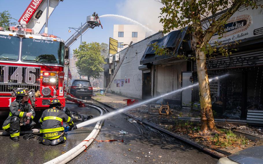 The blaze quickly reached five alarms and spread to several stores along the commercial stretch of road near Williamsburg St. East, New York, on August 20, 2023.