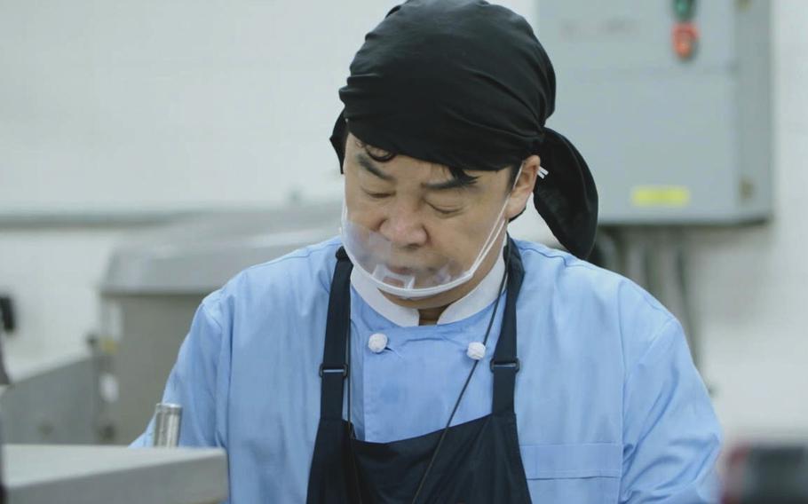 South Korean celebrity chef Baek Jong-won cooks for U.S. and South Korean troops at the Provider Grill dining facility on Camp Humphreys, South Korea, June 28, 2022.
