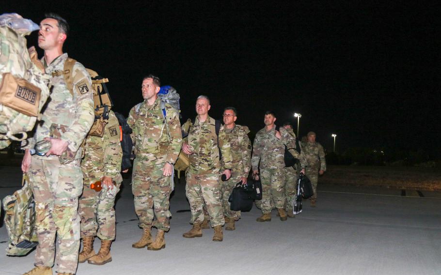 Soldiers from the 82nd Airborne Division and the 18th Airborne Corps file onto an Air Force C-17 Globemaster III aircraft in February 2022 at Fort Bragg, N.C., now Fort Liberty. The soldiers deployed to Europe following the Pentagon’s announcement of additional forces moving from the United States in support of NATO allies.