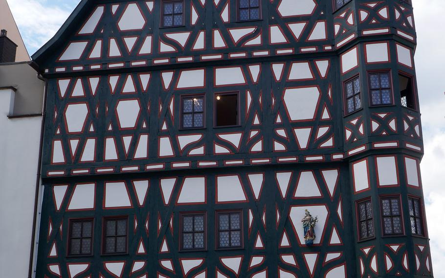 The old half-timbered rathaus, or city hall, in Fulda, Germany, dates to before 1500. The ground floor, now a glassed-in shop, was once used as a covered market.