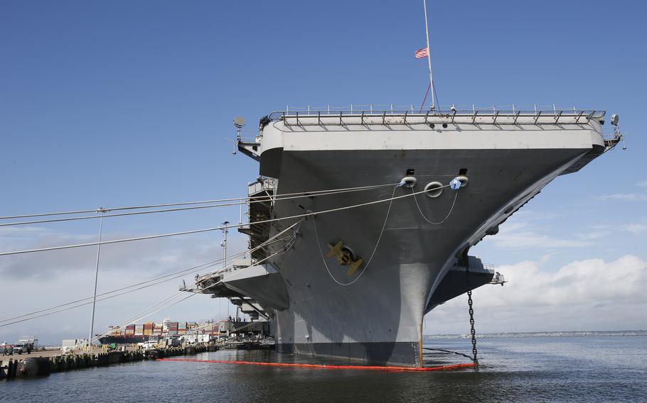 The nuclear aircraft carrier USS George Washington pier side at Norfolk Naval Station in Norfolk, Va., Sept. 30, 2016. A Navy investigation triggered by a series of suicides is recommending widespread improvements in housing, food, parking and internet for sailors, as well as changes to mental health and other personnel programs. The investigation began last year after seven service members assigned to the aircraft carrier USS George Washington died over a 12-month period ending April 2022, including three in one week. The carrier was docked for overhaul at Newport News shipyard.
