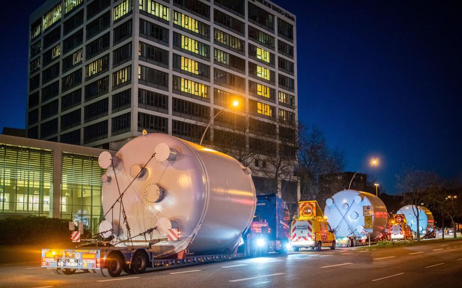Trucks transport fuel tanks through the streets of the St. Pauli district of Hamburg, Germany, on April 19, 2022.