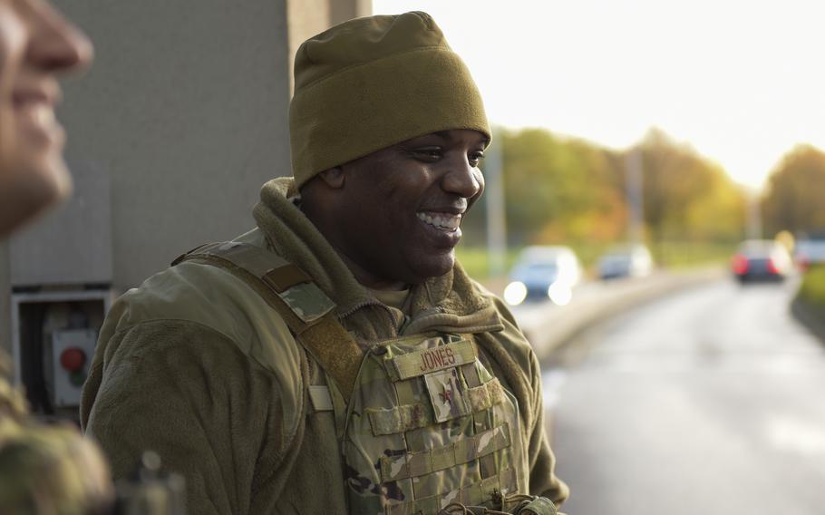 U.S. Air Force Brig. Gen. Otis Jones, 86th Airlift Wing commander, welcomes a driver to Ramstein Air Base while working with the 86th Security Forces Squadron to check IDs, Nov. 23, 2022. Jones this week encouraged airmen struggling with energy bills to seek help. 