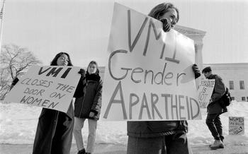 Protesters march outside the U.S. Supreme Court in 1996 while the justices hear the case on the all-male admissions policy at Virginia Military Institute. 