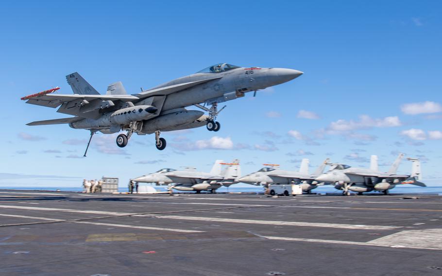 An F/A-18E Super Hornet lands on the aircraft carrier USS Nimitz in the Pacific Ocean on Oct. 20, 2022. The Navy still isn’t saying how jet fuel contaminated drinking water on the ship last month. 