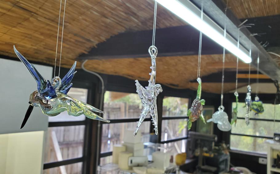 Some of the molten glass wildlife figurines available for purchase at Sculptured Glass at Rain Barrel Village in Islamorada, Fla.