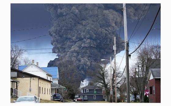 A black plume rises over East Palestine, Ohio, as a result of a controlled detonation of a portion of the derailed Norfolk Southern trains, Feb. 6, 2023. The government’s specialized plane loaded with advanced sensors that EPA brags is always ready to deploy within an hour of any kind of chemical disaster 24-7 didn’t fly in eastern Ohio until four days after the disastrous derailment there last year. A whistleblower says the Aspect plane could have provided crucial data about the chemicals spewing into the air and water around East Palestine as the wreckage burned. (AP Photo/Gene J. Puskar)