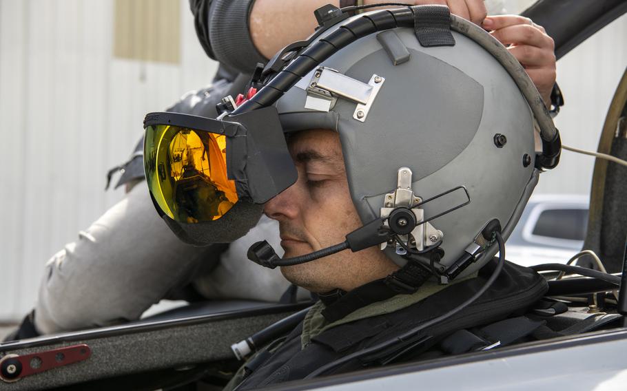U.S. Air Force Maj. Scott Thorup, Air Combat Command Training Support Squadron Detachment 14 commander, prepares for takeoff as Rina Shkrabova, Red 6 director of hardware design, connects the augmented reality headset to the Berkut in Santa Monica, Calif., April 13, 2021. The visor tracks the motions of the pilots’ heads and the position of the airframe to determine how the virtual assets are viewed and its location compared to the piloted aircraft.