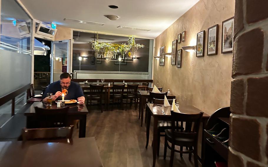 The front indoor seating at Osteria La Toscana restaurant in Weiden, Germany. There is also additional seating in the back of the restaurant. 