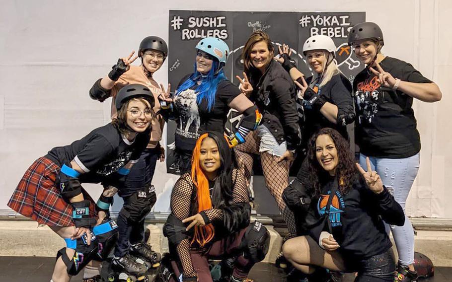 Fuji Flatliners pose with the Yokosuka Sushi Rollers  at Yokosuka Naval Base, Japan, on March 20, 2022. Front row, left to right: Billie Tortosa, Vanessa  Seay, Dailys Cintron. Back row: Hannah Howard, Danielle Frodge, Jessica Newman, Holly Dunn, April Lawrence. 