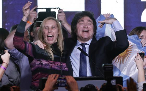 Argentine far-right libertarian economist and presidential candidate Javier Milei celebrates the results of the primary elections with his sister Karina Milei at Milei's headquarters in Buenos Aires on Aug. 13, 2023. The far-right libertarian economist Javier Milei gets 32.31% of the votes in the primaries for the Argentine presidential election, and becomes the protagonist of this election that will contest the former Security Minister Patricia Bullrich and the Economy Minister Sergio Massa. (Alejandro Pagni/AFP via Getty Images/TNS)