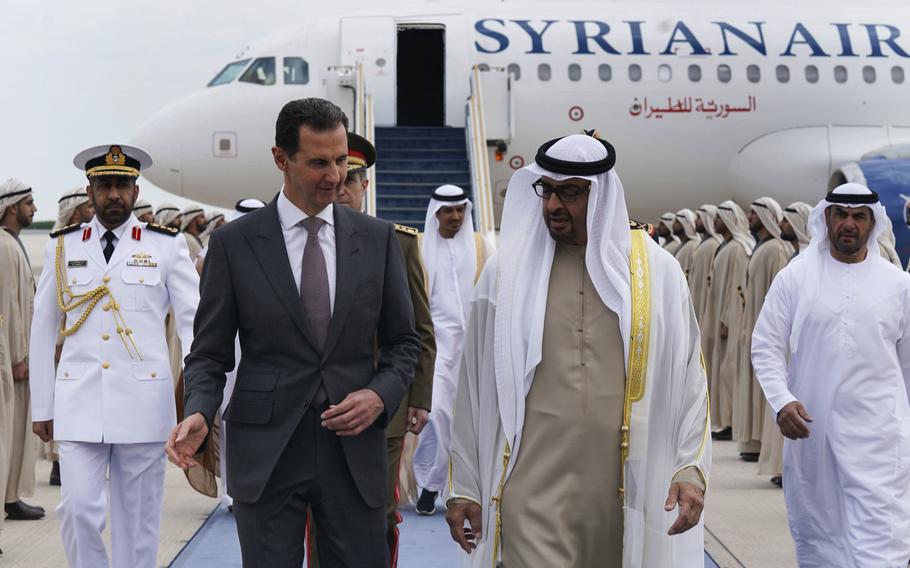 In this photo released by the Syrian Presidency, Syrian President Bashar Assad, left, speaks with UAE President Sheikh Mohammed bin Zayed Al-Nahyan, in Abu Dhabi, United Arab Emirates, Sunday, March 19, 2023.