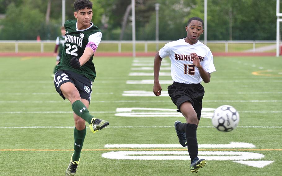 AFNORTH winger Ronnie Macauley shoots during the Lions' final pool-play match of the 2023 DODEA European soccer championship on May 16, 2023, at Kaiserslautern High School in Kaiserslautern, Germany. Trailing the play is Baumholder defender Elijah Washington.