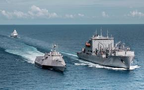 The Dutch frigate HNLMS Tromp, top, trains with the littoral combat ship USS Mobile and the dry cargo ship USNS Wally Schirra in the South China Sea, May 22, 2024.