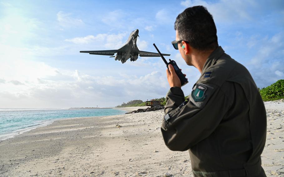 Air Force Capt. Orr Genish, 37th Bomb Squadron weapons systems officer, watches a B-1B Lancer bomber land at Naval Support Facility Diego Garcia, Oct. 17, 2021. 