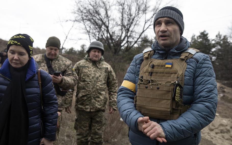 Kyiv Mayor Vitali Klitschko speaks to the media as he arrives close to the front line to attend a wedding between members of Ukraine's Territorial Defense Forces. 