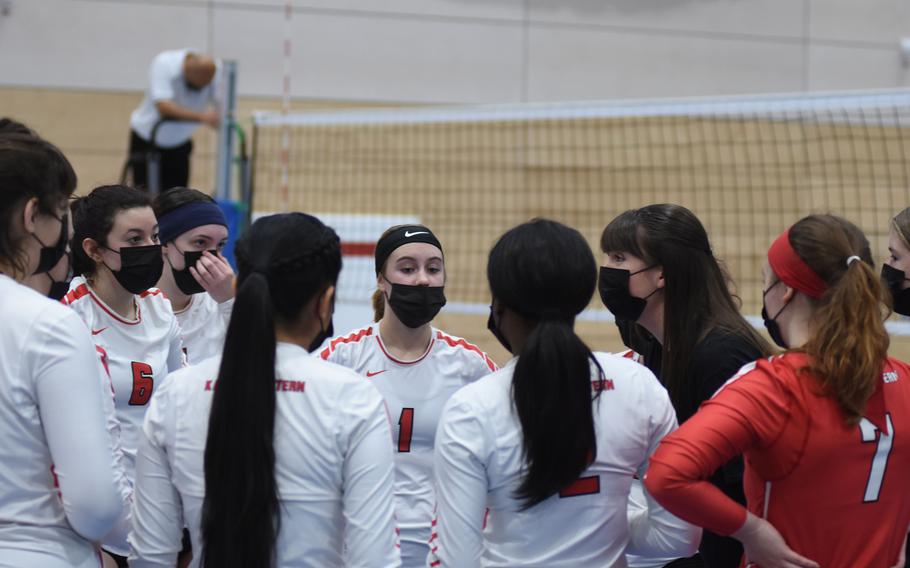 Kaiserslautern players huddle with coach Abby Weaver during semifinals play Saturday, Oct. 30, 2021, at the DODEA-Europe Division I girls’ volleyball championships. The Raiders beat Ramstein in three sets to take third place in the tournament.