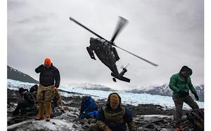 An Alaska Army National Guard UH-60L Black Hawk helicopter takes off after dropping off Air Force Mortuary Affairs Operations and Armed Forces Medical Examiner System recovery team members supporting Operation Colony Glacier at Colony Glacier, Alaska, on June 16, 2023. 