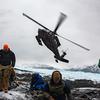 An Alaska Army National Guard UH-60L Black Hawk helicopter takes off after dropping off Air Force Mortuary Affairs Operations and Armed Forces Medical Examiner System recovery team members supporting Operation Colony Glacier at Colony Glacier, Alaska, on June 16, 2023. 
