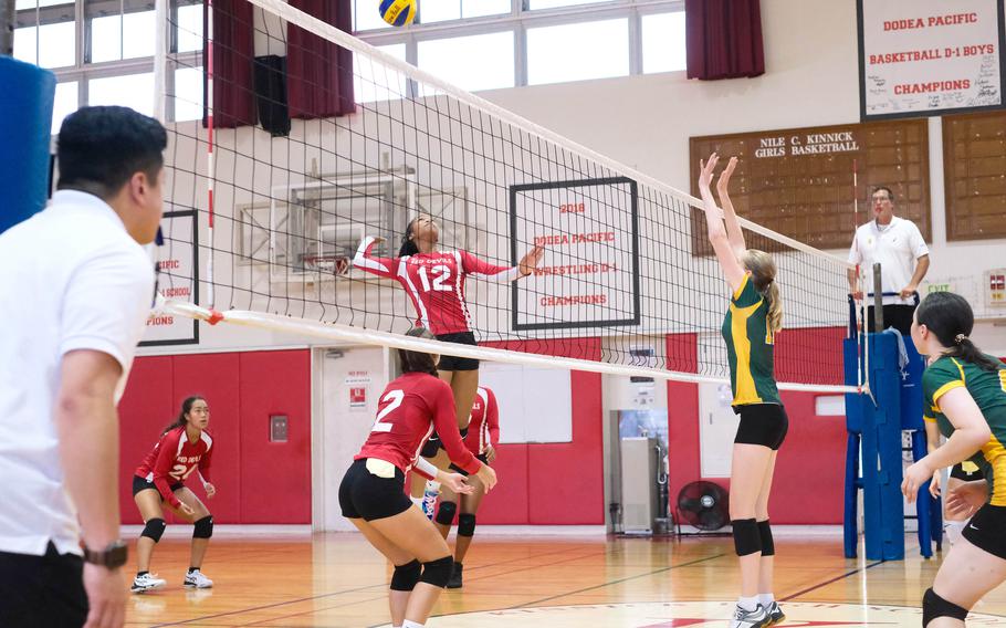 Nile C. Kinnick's Ja'lilah Brice prepares to spike against Robert D. Edgren's Kaitlyn Willets during Saturday's DODEA-Japan girls volleyball match. The Eagles won in four sets to split their weekend sereies with the Red Devils.