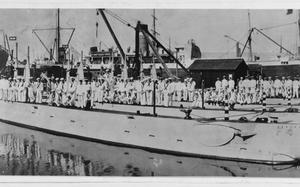 A 1914 photo shows the U.S. submarine F-1, nearest the dock, which sank after a collision with submarine F-3, moored right beside it, in 1917. MUST CREDIT: Roy L. Noggle/U.S. Naval History and Heritage Command