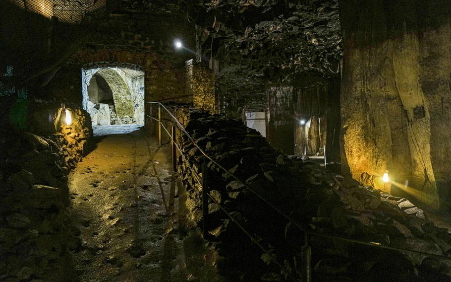 Underground walls that once protected beer barrels line the lava caverns in Mendig, Germany. The caverns were used for beer storage due to their constant low temperatures.