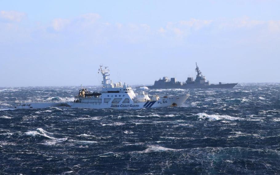 The Japanese coast guard veseel Shikine trains with Maritime Self-Defense Force ships east of Oshima Island, Dec. 19, 2022.