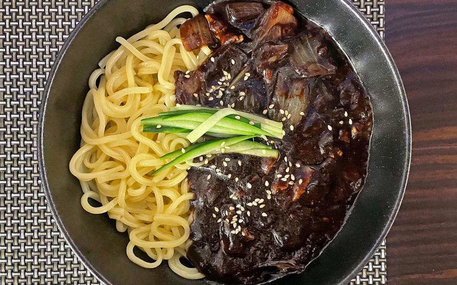 A dish of noodles, pork, vegetables and a chunjang sauce, which has a black-bean base, served at the Korean restaurant Ido in Sulzbach, Germany, March 12, 2022.