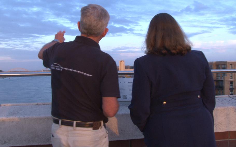 Retired Royal Dutch Air Force Lt. Col. Tim Ruijling, left, points out bridges east of the Oversteek Bridge in Nijmegen, the Netherlands, to U.S. Embassy charge d'affaires and acting ambassador Marja Verloop, on Friday, Aug. 13, 2021, ahead of the 2,491st Sunset March. 