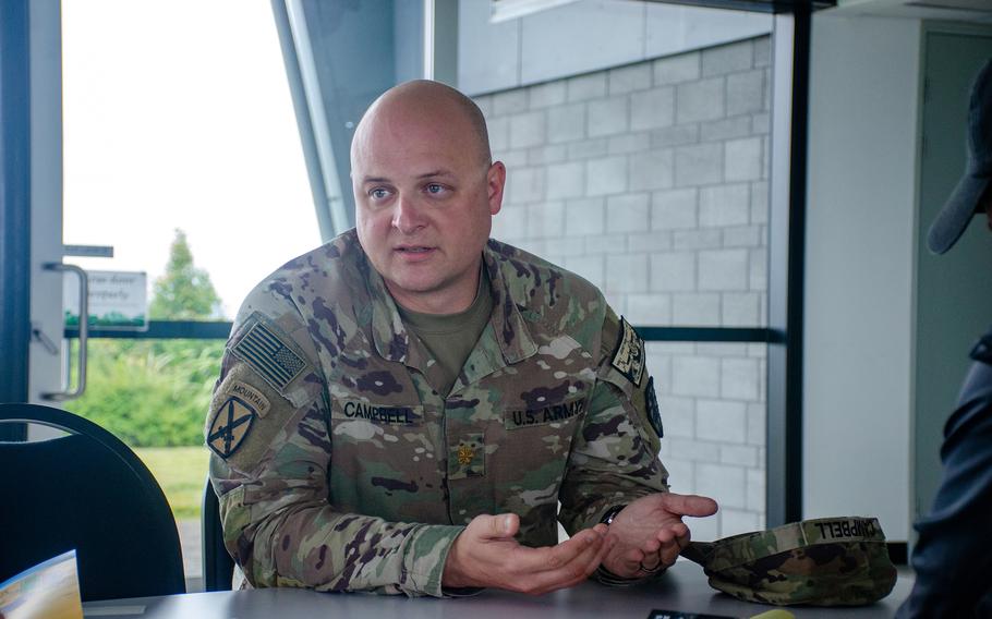 U.S. Army Maj. Ryan Campbell, joint operations officer for 7th Transportation Brigade (Expeditionary), discusses a modular pier project in Bowen, Australia, July 27, 2023. The project is part of the Talisman Sabre exercise. 