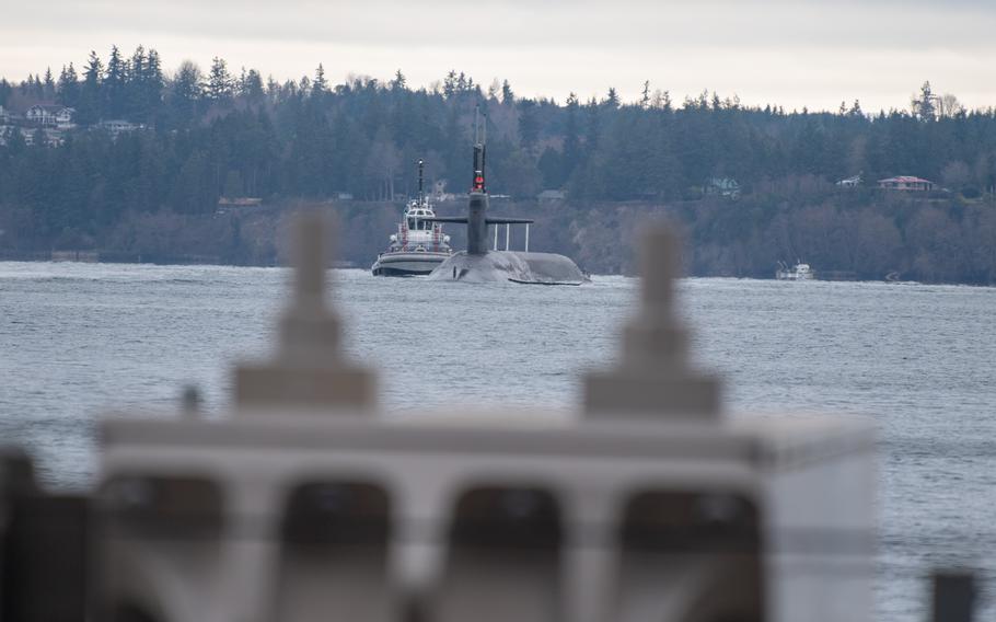 USS Kentucky, an Ohio-class ballistic missile submarine, transits the Hood Canal as the ship returns to its homeport of Naval Base Kitsap, Wash., in December 2021. 