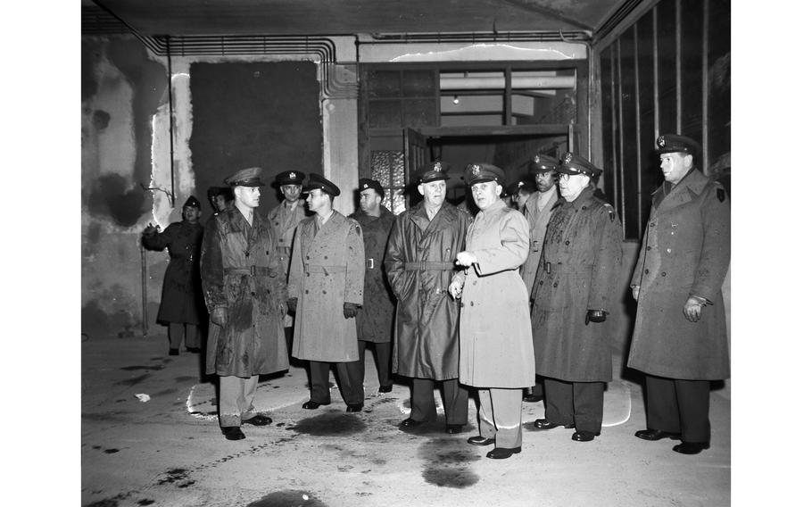 Lt. Gen. Clarence R. Huebner (center) tours one of the buildings of the Kitzingen Basic Training Center for Negro troops under renovation. Brig. Gen. Lewis C. Beebe (right of Huebner) — the center’s commandant — discusses the preparations for a vast recreation hall with two basketball courts, a snack bar, a tailor shop and other facilities.