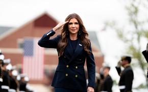 Department of Homeland Security (DHS) Secretary Kristi Noem marches onto Cadet Memorial Field during the 144th Commencement Exercises at the U.S. Coast Guard Academy, May 21, 2025. Noem shared the details of Force Design 2028 which includes plans to purchase new aircraft, grow the workforce by 15,000 people, fix agin facilities and begin a once-in-a-generation transformation of the 234-year old maritime service. (U.S. Coast Guard photo by Petty Officer 3rd Class Matt Thieme.)