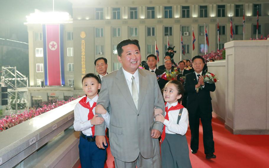 This image from the state-run Rodong Sinmun newspaper shows North Korean leader Kim Jong Un attending a military parade in Pyongyang, early Thursday, Sept. 9, 2021. 