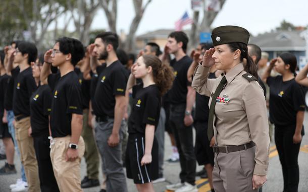 Lt. Col. Erin Fritzler, commander of the Los Angeles Recruiting Battalion, and recruits salute Lt. Gen. Jonathan Braga, the commanding general of the United States Army Special Operations Command, during the Torrance Armed Forces Day Parade in Torrance, California May 17, 2025. The Department of Defense sponsors the event each year to honor the service and sacrifices of the U.S. armed forces while fostering patriotism and community connections. (Photo by Staff Sgt. Brea DuBose)
