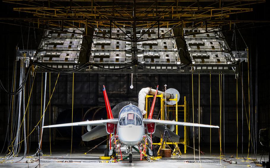 A  T-7A Red Hawk sits under bright lights used to create heat in the McKinley Climatic Lab at Eglin Air Force Base, Fla.