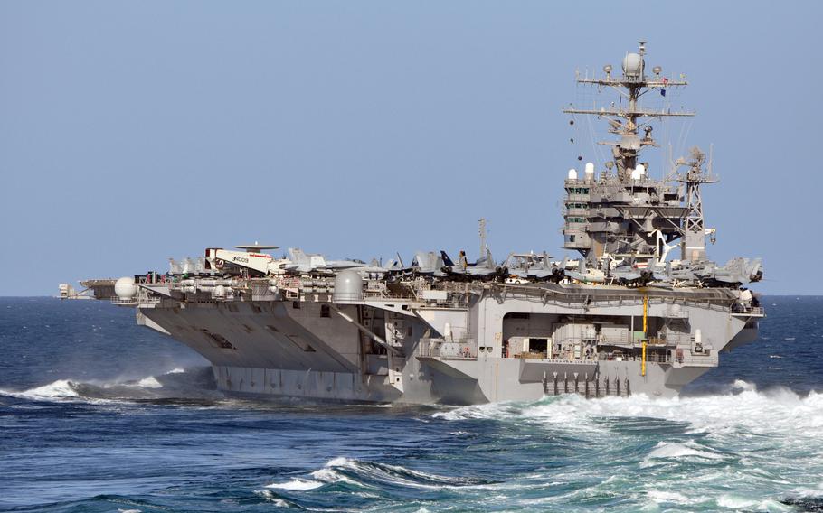 The USS Abraham Lincoln maneuvers in the Arabian Sea in December 2010. Contaminated water was found in some of the tanks aboard the aircraft carrier as it was moored off the Southern California coast in September 2022, Navy officials said.