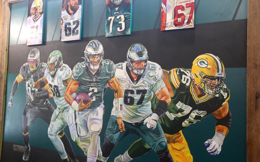 A mural inside "The Bro Barn" depicts some of the players who have worked out at the facility.