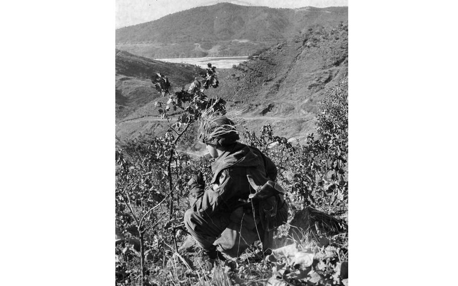 A soldier takes a smoke break.