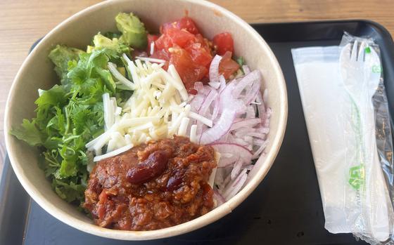 The Mexican chili salad from Down to Plant in Tokyo is topped with vegan chili con carne, avocado, cilantro, tomato, red onion, rice and vegan cheese. 