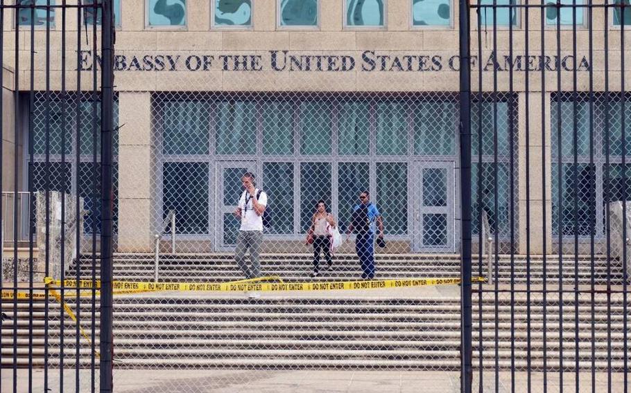 Workers at the U.S. Embassy in Havana leave the building on Sept. 29, 2017, after the State Department announced that it was withdrawing all but essential diplomats from the embassy.