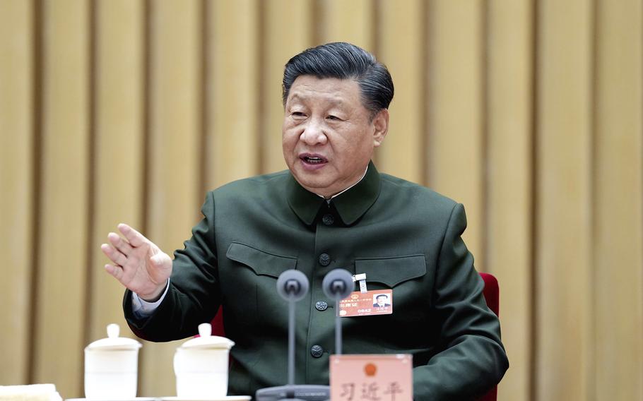 In this photo released by Xinhua News Agency, Chinese President Xi Jinping attends a plenary meeting of the delegation of the People’s Liberation Army and the People’s Armed Police Force during the first session of the 14th National People’s Congress in Beijing, on Wednesday, March 8, 2023. Xi has called for “more quickly elevating the armed forces to world-class standards,” in a speech coming days after he warned the country was threatened by a U.S.-led campaign of “containment, encirclement and suppression of China.”