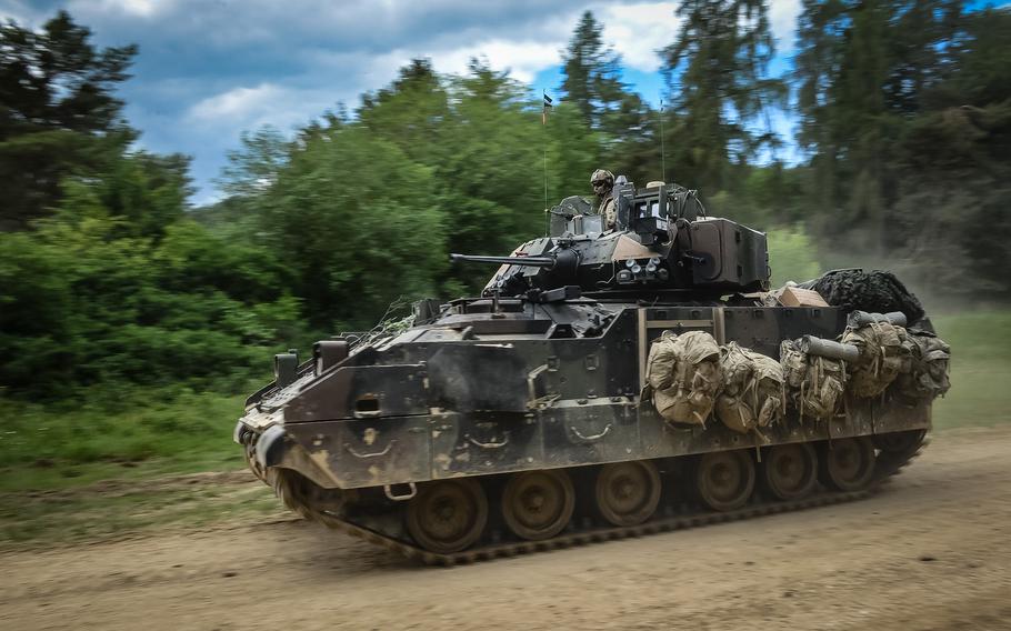 A U.S. Army M2 Bradley infantry fighting vehicle drives along a road during a multinational exercise at Hohenfels Training Area in Germany on June 8, 2022. This month, the first Ukrainian battalion completed training on using the Bradley, which the U.S. is sending to Ukraine for its fight against Russia.