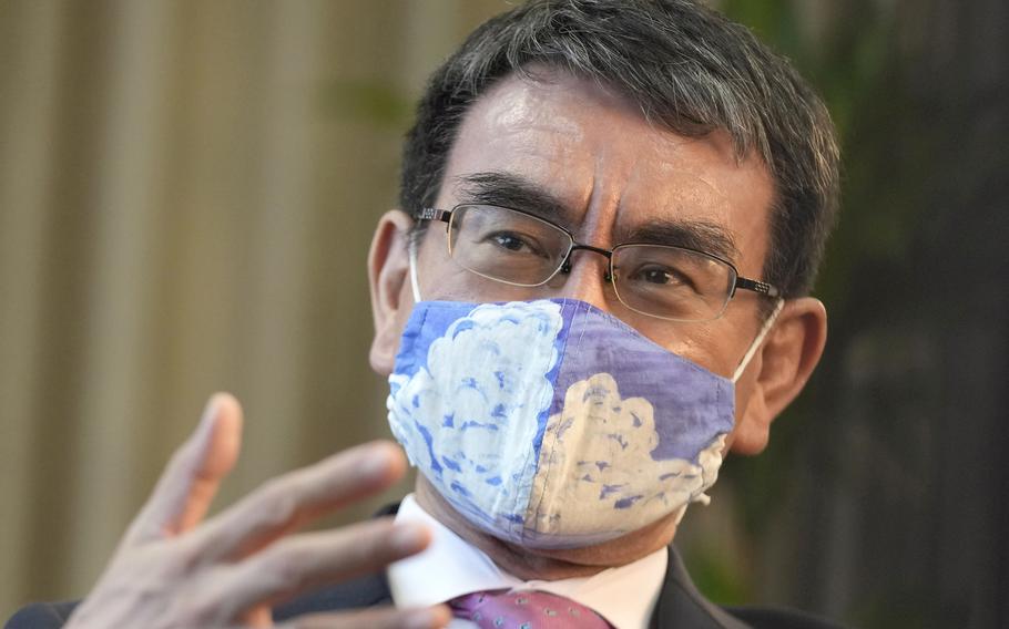 In this July 28, 2021, file photo, Taro Kono, Japan's minister in charge of a huge vaccination campaign, speaks during an interview with The Associated Press at his office in Tokyo.