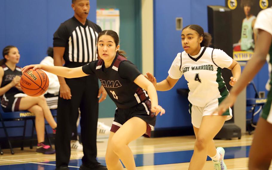 Zama's Lindsey So deibbles in front of Daegu's Caylee Shipman. The Trojans won 36-31.