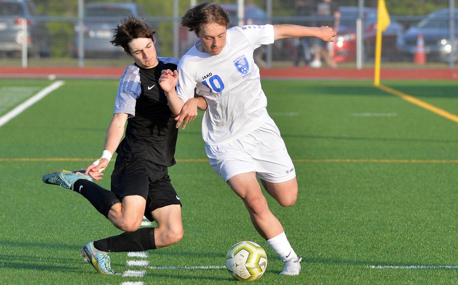 Christian Groves gets ready to clear the ball from Wiesbaden’s Asher Anderson in the boys Division I final at the DODEA-Europe soccer championships in Ramstein, Germany, May 18, 2023. Stuttgart beat Wiesbaden 2-1 for the title