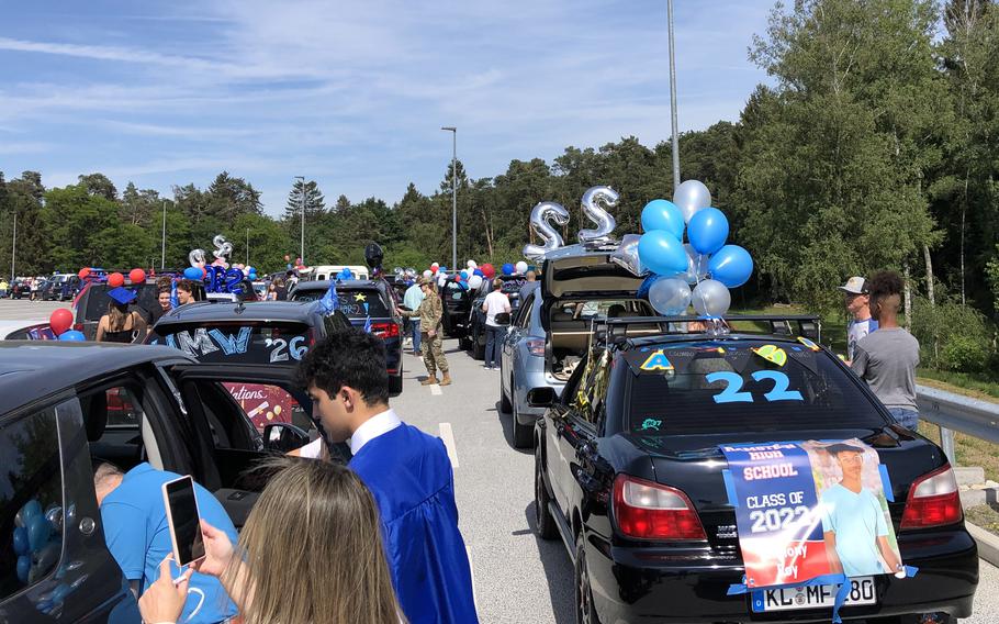 Ramstein High School seniors and their families line up for the graduation parade in cars festooned  with balloons, streamers, banners and other decorations on Thursday, June 2, 2022, at Ramstein Air Base, Germany.