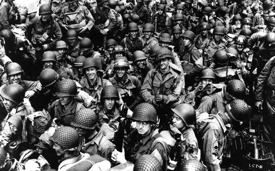 Army troops on board a LCT, ready to ride across the English Channel to France. Some of these men wear 101st Airborne Division insignia. Photograph released 12 June 1944. 